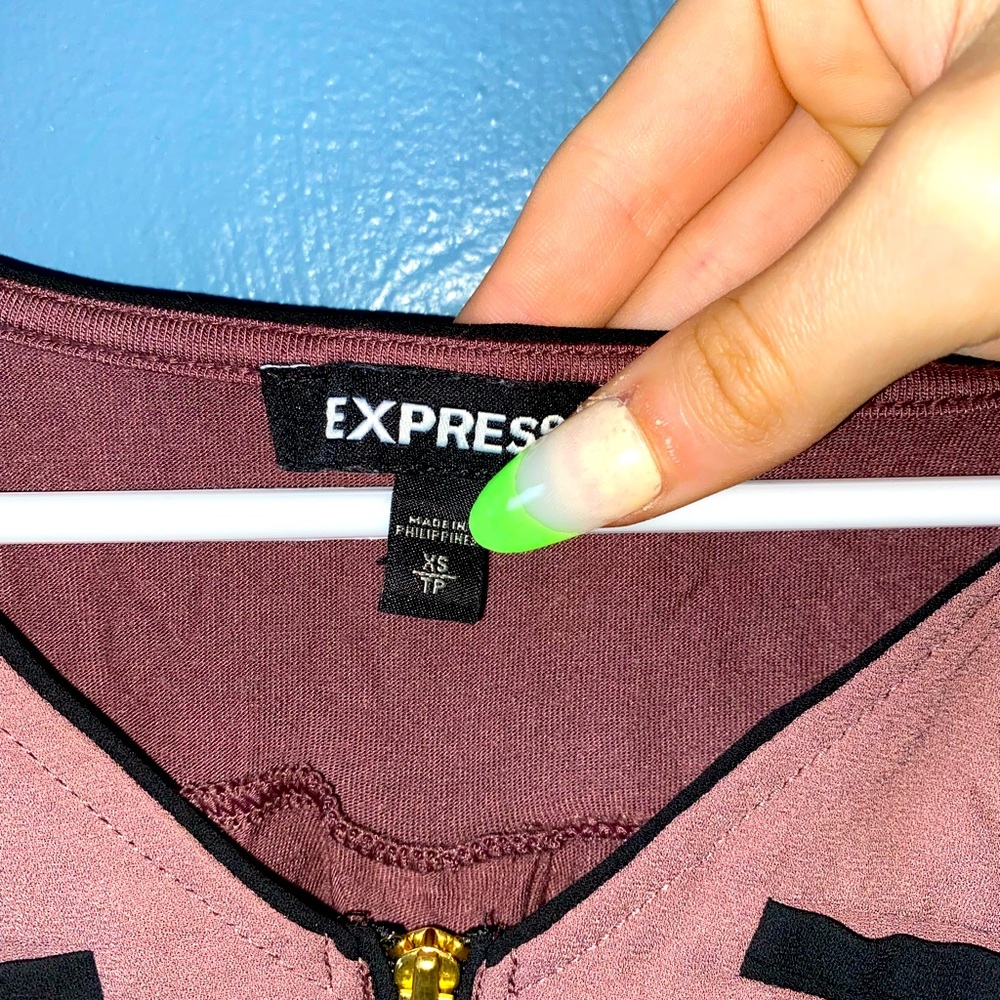 A woman’s tanktop size XS, and only been worn a few times and in good condition